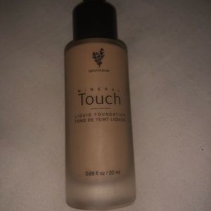 Open bottle of VELOUR Liquid Touch Foundation